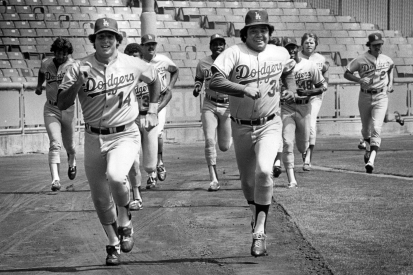 Dodger pitcher Fernando Valenzuela races with Mike Scioscia in their first full workout since the strike on Aug. 1, 1981.