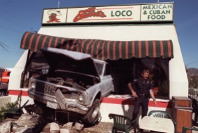 ME.Drive Thru.1.0305.RM.3 Burbank Police officer Larry Hill at the scene where a runaway truck backed through the front of El Burrito Loco, at Victory and Burbank Blvds in Burbank. The truck crossed two streets before plowing backwards into the restaurant. Two occupants of the truck suffered minor injuries. Half dozen people, both inside and out, were injured in the morning crash. Rick Meyer/LAT WED FOLDER also moved to ART FOR SFV. Mandatory Credit: Rick Meyer/The LA Times